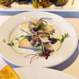 An amuse bouche that arrived between the starter and main - mushrooms with truffle on toast points