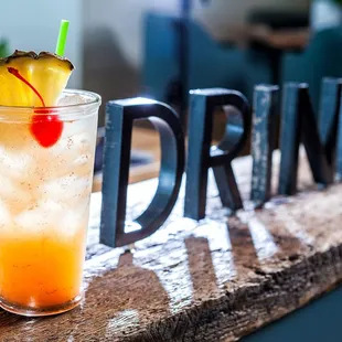 a drink with a pineapple garnish