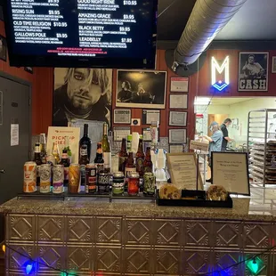 a bar with a menu on the wall