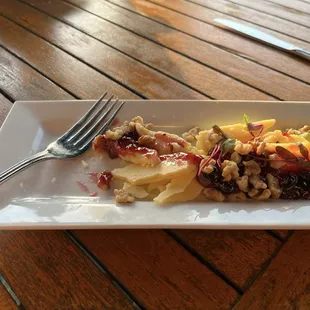 Cheese plate w/ Irish cheddar, black currant jelly and walnuts.