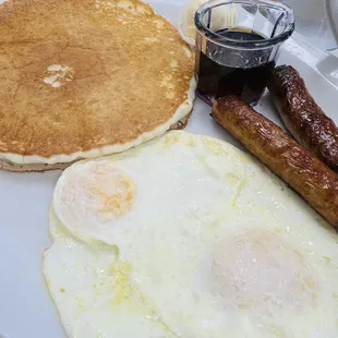 Hot cakes with eggs and sausage