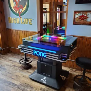 a pool table with neon lights
