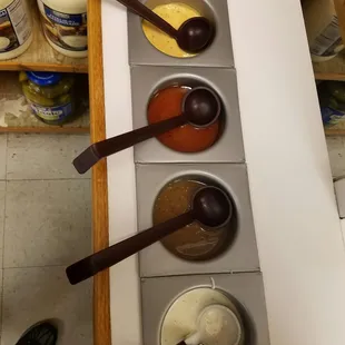 From bottom to top: Ranch Dressing, Italian Dressing, French Dressing, Thousand Island Dressing.