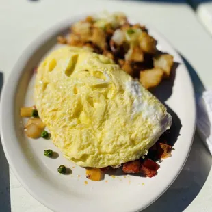 an omelet and potatoes