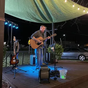 a man playing a guitar