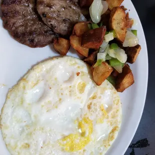 Eggs, fried hard, sausage and home fries