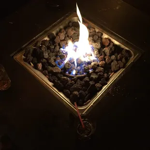 a fire pit with rocks in it