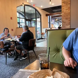 a man sitting at a table in a restaurant