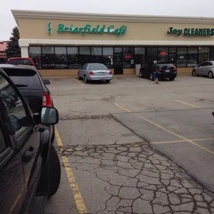 a car parked in front of the restaurant