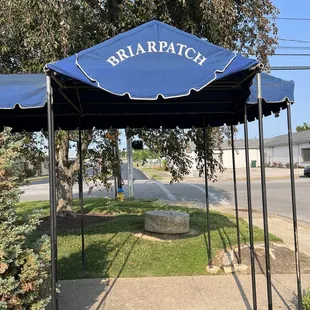 a bench under a canopy