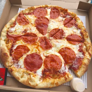 a pepperoni pizza in a box