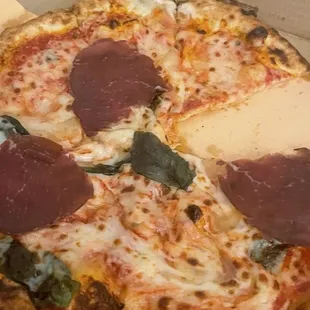 3 pieces of bresaola on the entire pizza - and cut up pieces at that...