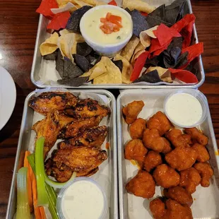 three trays of food on a table