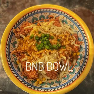 a bowl of noodles and meat