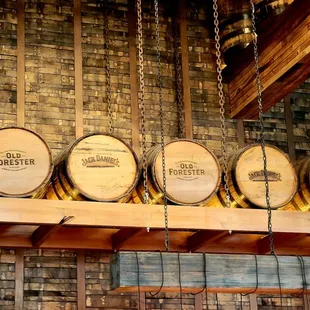 a row of barrels on a shelf