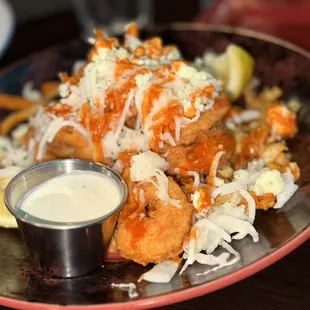 a plate of fried shrimp and rice