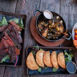 Hummus platter, duck bacon wontons, brussel sprouts, and bacon flight.