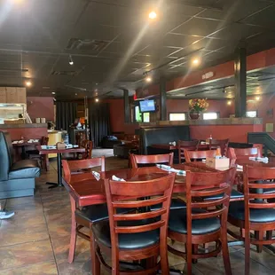 a woman standing in the dining room