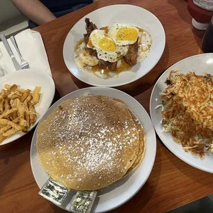 The Tupelo Honey Chick, original pancakes with sides of eggs, hashbrowns, and Parmesan truffle fries