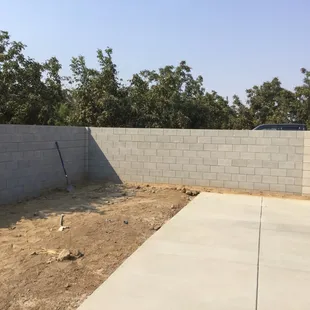 Concrete block perimeter wall around pool