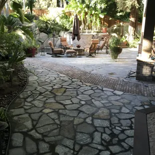 Flagstone pavers patio with curved brick walkway