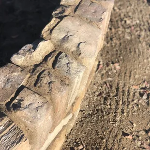 Custom courtyard wall with stone caps