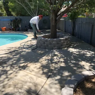 Concrete slab install and planter built with retaining wall block
