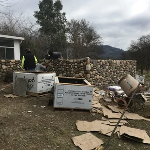 River rock courtyard wall