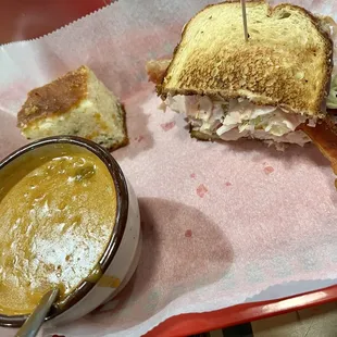 Half sandwich and soup (Smokey Joe Sandwich and Cup of Chicken La-La Soup)