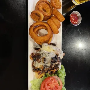 Mushroom Swiss burger, onion rings
