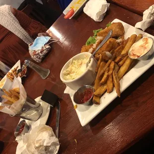 Half eaten fish and chips.  SOOOO GOOD