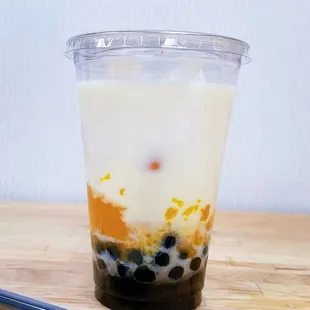 a plastic cup of bubble tea