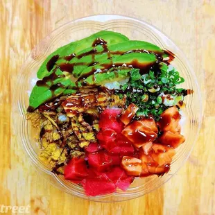 a bowl of food on a wooden table