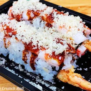 a plate of sushi with shrimp