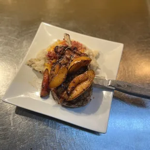 a plate of food and a knife