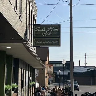 people sitting at tables outside