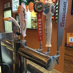 a row of beer taps
