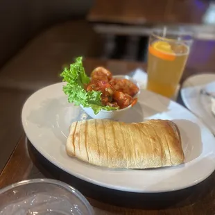 Shrimp cocktail with sliced sourdough bread...happy hour.
