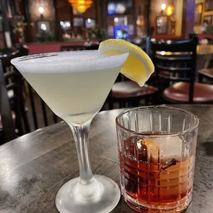a cocktail and a glass of beverage