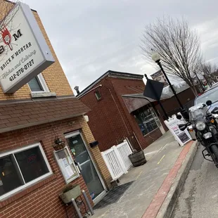  motorcycle parked in front of the restaurant