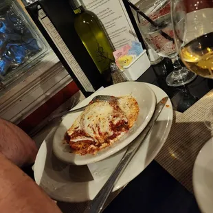 a plate of food and a glass of wine