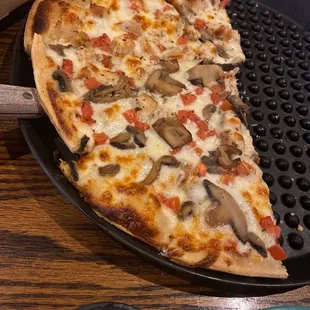 a slice of mushroom pizza