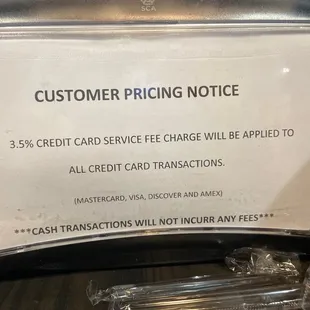 Signage posted to napkin dispenser