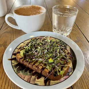 Avocado toast= wheat berry bread, avocado , fig glaze, red pepper flakes and micro greens