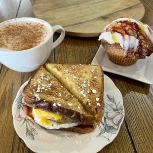 French toast sausage egg&amp;cheese, lemon raspberry muffin and a hot chi tea.
