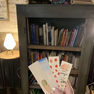 Library area. Plus there&apos;s cute cards and bookmarks for sale, made by a local artist.