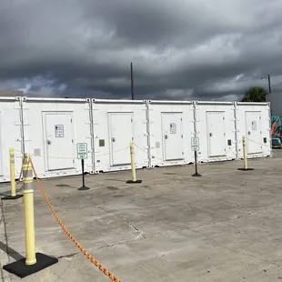 a row of white storage containers