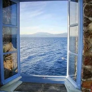 a window with a view of the ocean