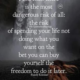 a woman standing in front of a waterfall