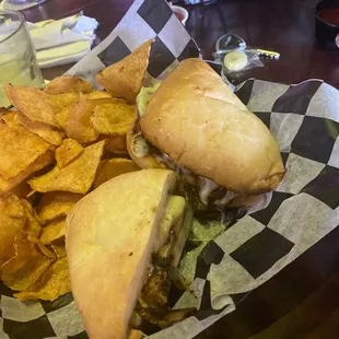 a sandwich and chips in a basket